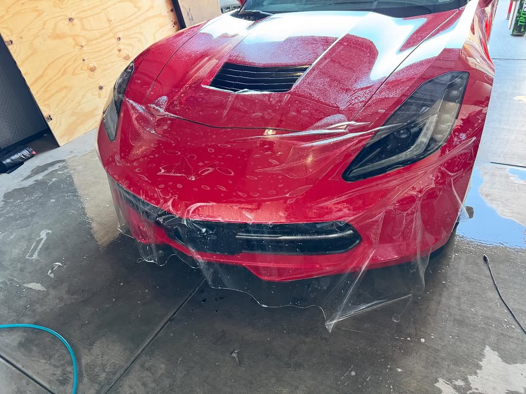 Paint protection film install on red Corvette